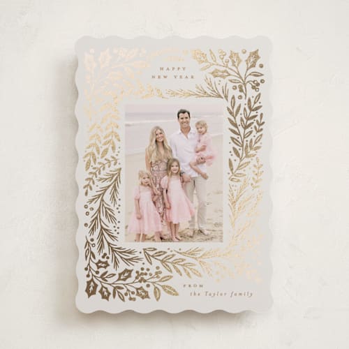 This is a buttercream foil pressed holiday cards with foil pressed by Alethea and Ruth called gilded forest printing on recycled smooth signature in standard