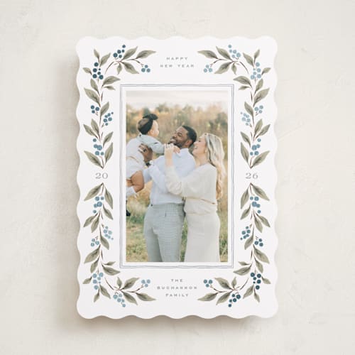 This is a juniper berry foil pressed holiday cards with foil pressed by Wildfield Paper Co called poinsettia + pine printing on recycled smooth signature in standard