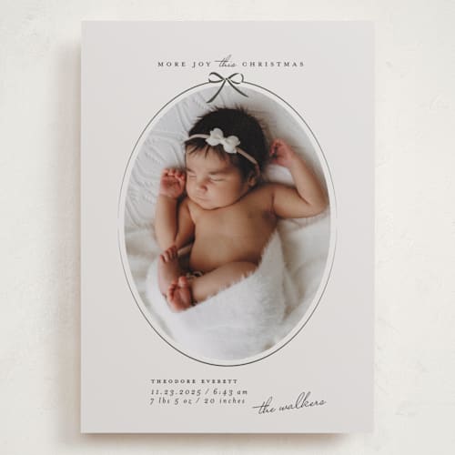 This is a pine babys first christmas with standard by Maja Cunningham called more joy printing on recycled smooth signature in grand