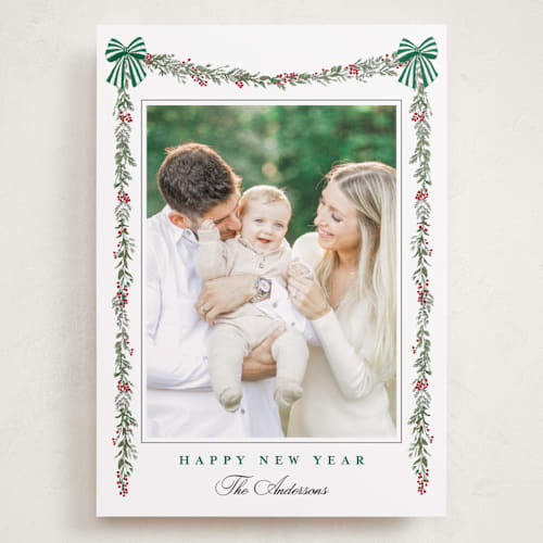 This is a pine holiday photo cards with standard by Susan Moyal called holly & bows printing on recycled smooth signature in grand