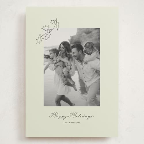This is a lime holiday photo cards with standard by Angela Garrick called hung holly printing on signature in grand