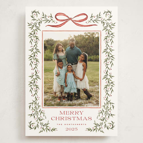 This is a holly berry holiday photo cards with standard by Wildfield Paper Co called laurel wreath printing on signature in grand