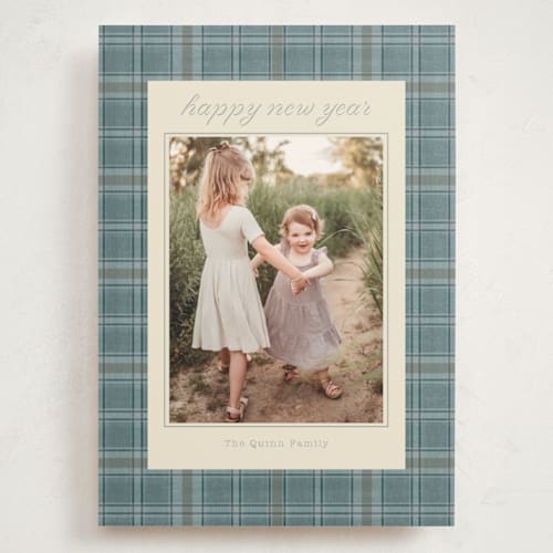 This is a powder blue holiday photo cards with standard by Baumbirdy called traditional plaid printing on signature in grand