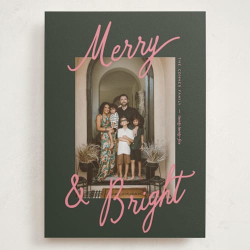 This is a mistletoe holiday photo cards with standard by Pixel and Hank called jottings printing on signature in grand
