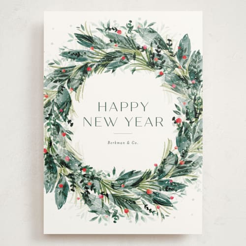 This is a vert holiday photo cards with standard by Jackie Crawford called watercolor festive wreath printing on signature in grand