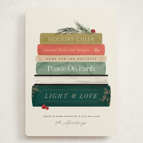 This is a holly jolly holiday photo cards with standard by Kate Ahn called book stack printing on signature in grand