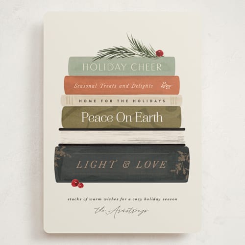 This is a dried orange holiday photo cards with standard by Kate Ahn called book stack printing on signature in grand