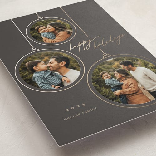 This is a coal petite holiday cards with foil pressed by Erin German called ornaments printing on recycled smooth signature in petite