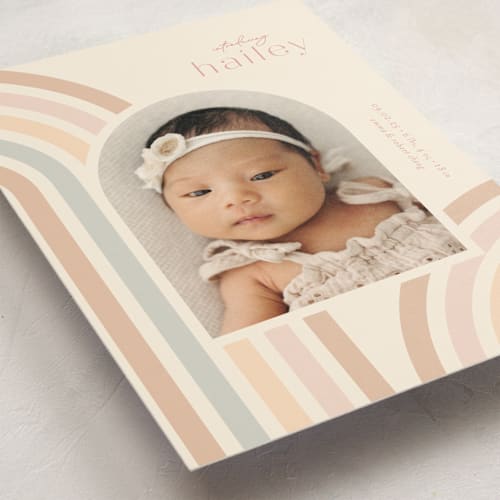 This is a taupe birth announcement postcards with standard by Ashley Iwafuchi called mod rainbow arch printing on signature in postcard