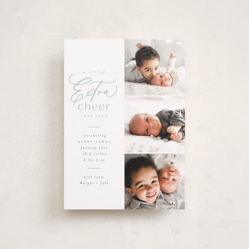 This is a mint babys first christmas with standard by Everett Paper Goods called extra cheer here printing on recycled smooth signature in petite