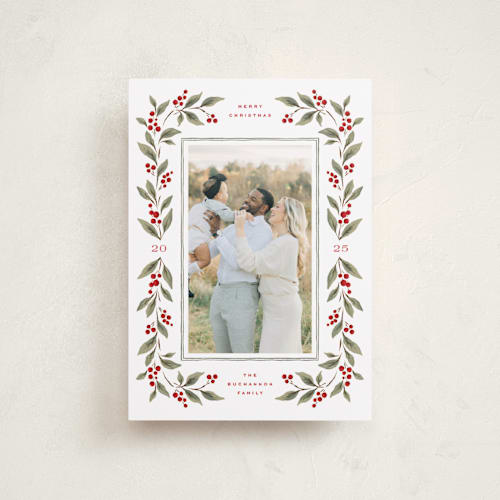 This is a mistletoe petite holiday cards with standard by Wildfield Paper Co called poinsettia + pine printing on recycled smooth signature in petite