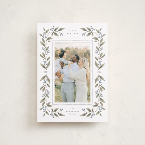 This is a juniper berry petite holiday cards with standard by Wildfield Paper Co called poinsettia + pine printing on recycled smooth signature in petite