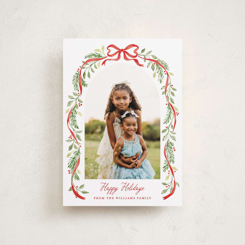 This is a cardinal petite holiday cards with standard by Sarah Knight called ribbon arch printing on recycled smooth signature in petite