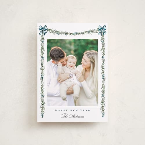 This is a winter berry petite holiday cards with standard by Susan Moyal called holly & bows printing on recycled smooth signature in petite