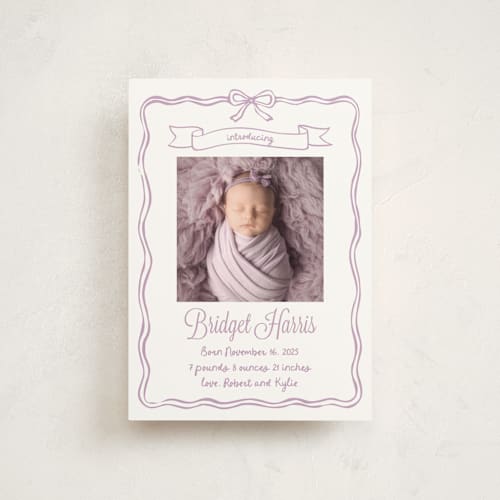 This is a lavander birth announcement postcards with standard by Cass Loh called bow frame printing on signature in postcard