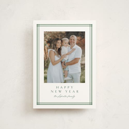 This is a pine christmas postcards with standard by Lea Delaveris called trim printing on signature in postcard