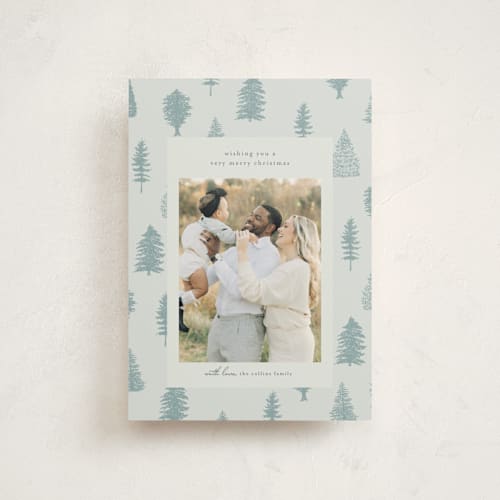 This is a ice christmas postcards with standard by Heather Cairl called all evergreen printing on signature in postcard