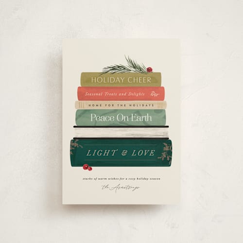 This is a holly jolly christmas postcards with standard by Kate Ahn called book stack printing on signature in postcard