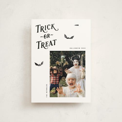 This is a onyx halloween party invitations cards with standard by Hooray Creative called trick-or-treat printing on signature in postcard