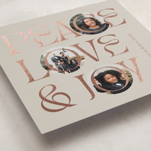 This is a toffee foil pressed holiday cards with foil pressed by Carolyn Kach called peace love & joy printing on recycled smooth signature in standard