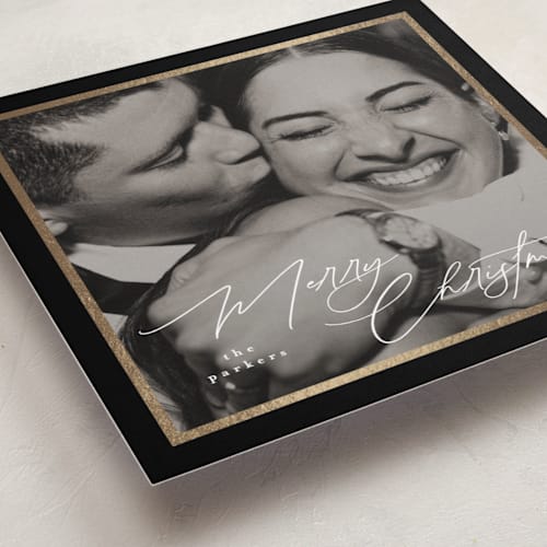 This is a licorice foil pressed holiday cards with foil pressed by Tamara Hilje called holiday soneto printing on recycled smooth signature in standard