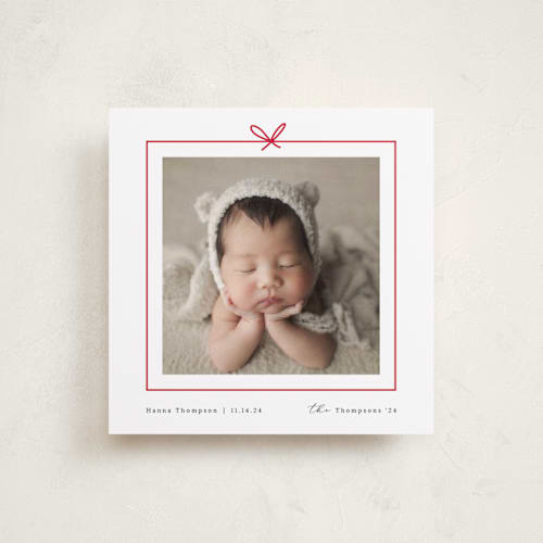 This is a holly berry babys first christmas with standard by Ghazal Ali called christmas present printing on recycled smooth signature in standard