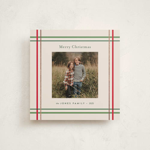 This is a vanilla foil pressed holiday cards with foil pressed by Poised Avenue called perfectly plaid printing on recycled smooth signature in standard