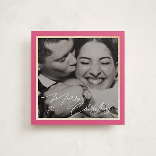 This is a raspberry foil pressed holiday cards with foil pressed by Tamara Hilje called holiday soneto printing on recycled smooth signature in standard