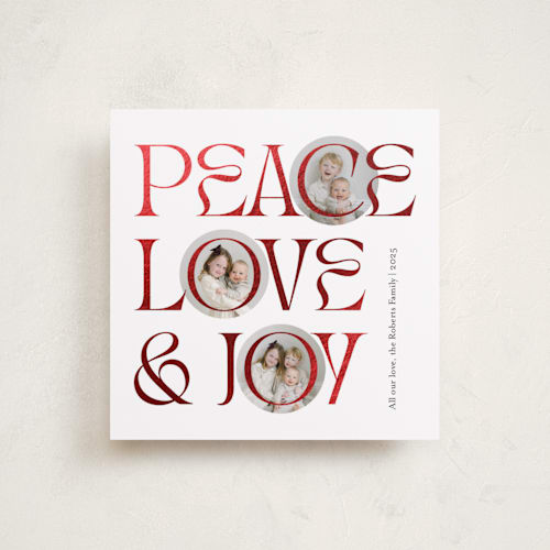 This is a snow foil pressed holiday cards with foil pressed by Carolyn Kach called peace love & joy printing on recycled smooth signature in square