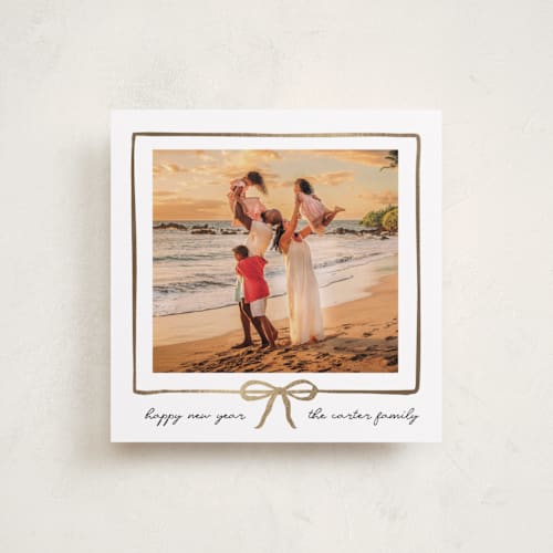 This is a snowfall foil pressed holiday cards with foil pressed by Jennifer Lew called lil bow printing on recycled smooth signature in square