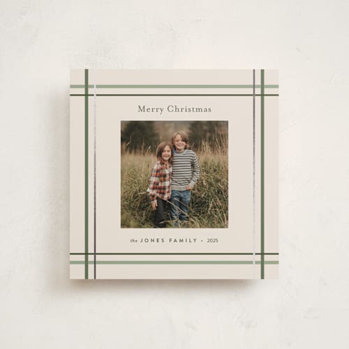 This is a sage foil pressed holiday cards with foil pressed by Poised Avenue called perfectly plaid printing on recycled smooth signature in square