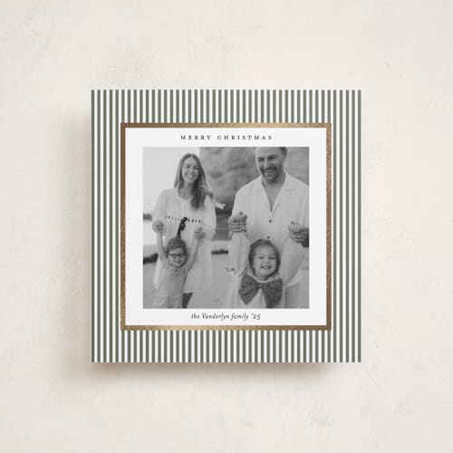 This is a sage green foil pressed holiday cards with foil pressed by Lucrecia Caporale called striped frame printing on recycled smooth signature in square