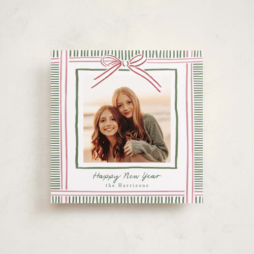 This is a pink sand holiday photo cards with standard by Chris Griffith called holiday wrap printing on recycled smooth signature in square