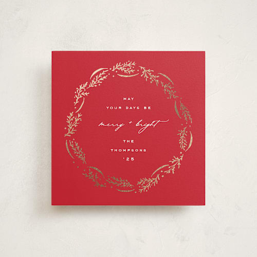 This is a poinsettia foil pressed holiday cards with foil pressed by Amy Kross called wrapped wreath printing on signature in square