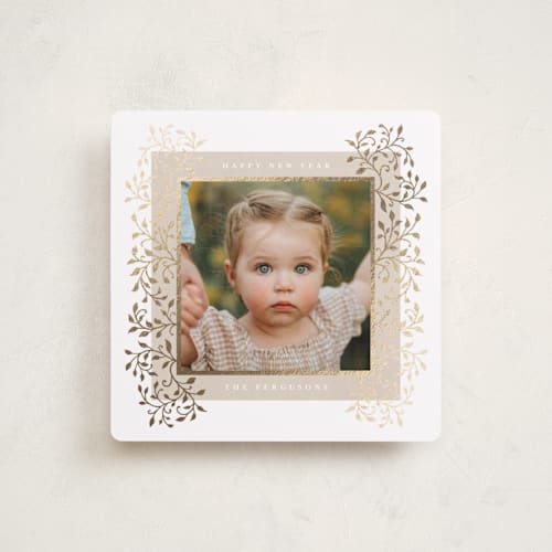 This is a marshmallow foil pressed holiday cards with foil pressed by Tamara Hilje called laurel printing on recycled smooth signature in square