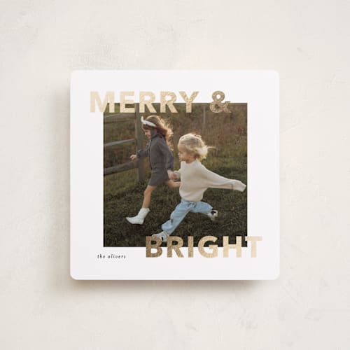 This is a snowflake foil pressed holiday cards with foil pressed by Angela Thompson called merry bright printing on recycled smooth signature in square