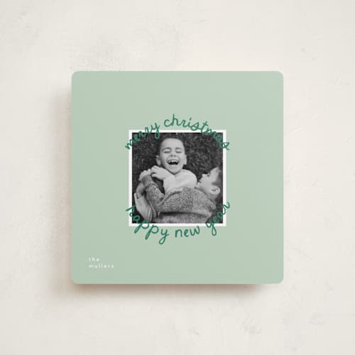 This is a mistletoe holiday photo cards with standard by Christie Garcia called circale printing on recycled smooth signature in square