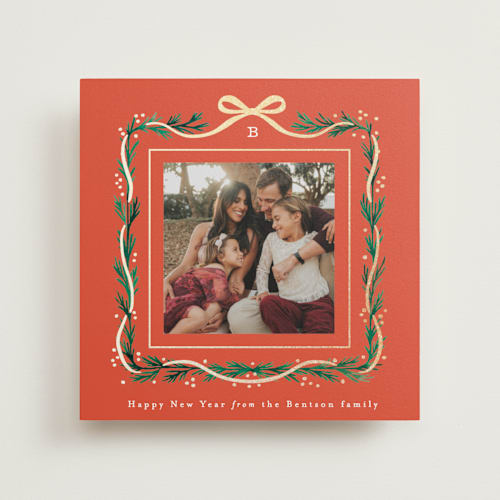 This is a tangerine photo mount holiday cards with foil pressed by Alethea and Ruth called garland border printing on recycled in photo_mount