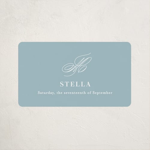This is a powder blue baby shower favor labels with standard by Jennifer Postorino called polished printing on uncoated sticker paper in sticker