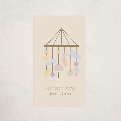 This is a vanilla baby shower favor labels with standard by Angela Thompson called mod baby printing on uncoated sticker paper in sticker