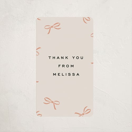 This is a coral baby shower favor labels with standard by Olivia Kanaley Inman called wrapped up printing on uncoated sticker paper in sticker