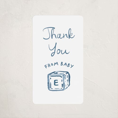 This is a baby blue baby shower favor labels with standard by Claudia Orengo called letter box printing on uncoated sticker paper in sticker