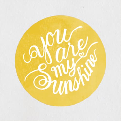 This is a gold custom stickers with standard by Shannon Chen of Four Wet Feet Studio called you are my sunshine printing on uncoated sticker paper in sticker