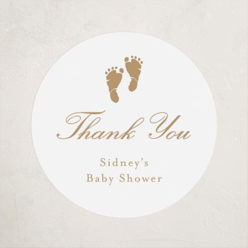 This is a golden baby shower favor labels with standard by Stacey Meacham called footprint printing on uncoated sticker paper in sticker