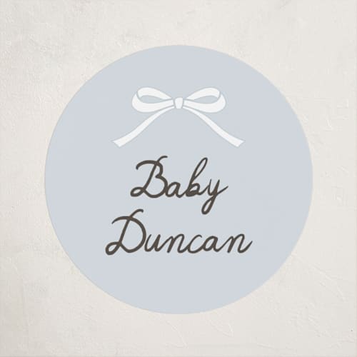 This is a sky baby shower favor labels with standard by Maria Alou called scallop & little bow printing on uncoated sticker paper in sticker