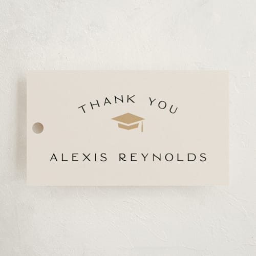 This is a ecru graduation tags with standard by Hooray Creative called official party printing on signature in tag
