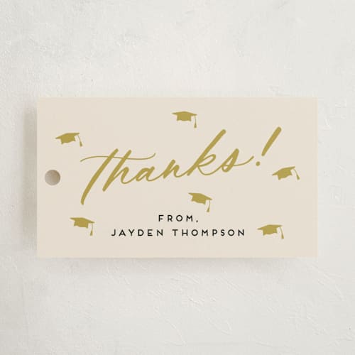 This is a mustard graduation tags with standard by Louise Kay called celebrate the grad printing on signature in tag
