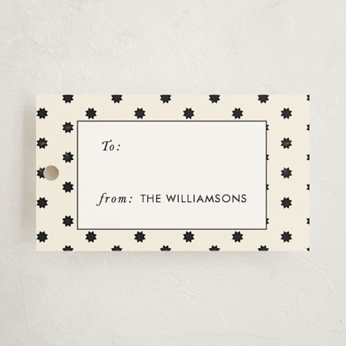 This is a cream gift tags with standard by Rebecca Durflinger called geo stars printing on signature in tag