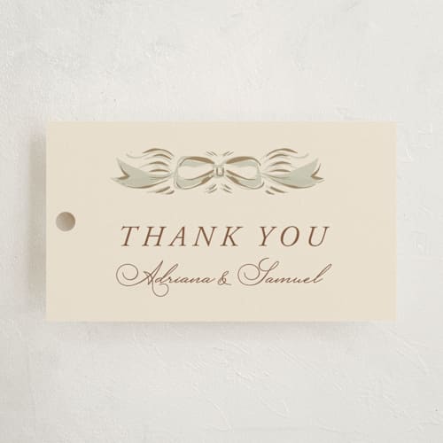 This is a buttercream baby shower favor tags with standard by Lucrecia Caporale called scallop border printing on signature in tag