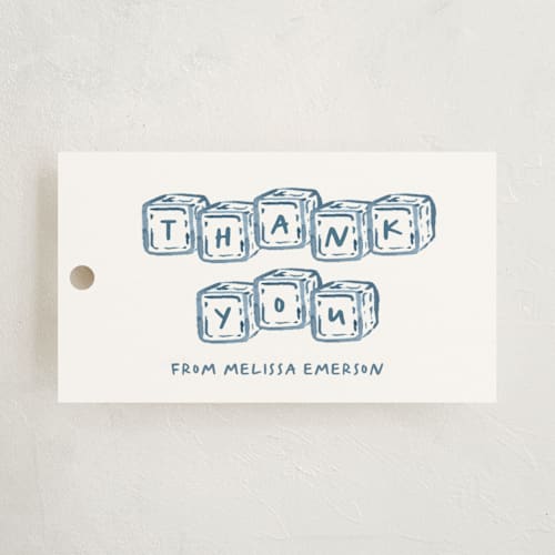 This is a baby blue baby shower favor tags with standard by Claudia Orengo called letter box printing on signature in tag